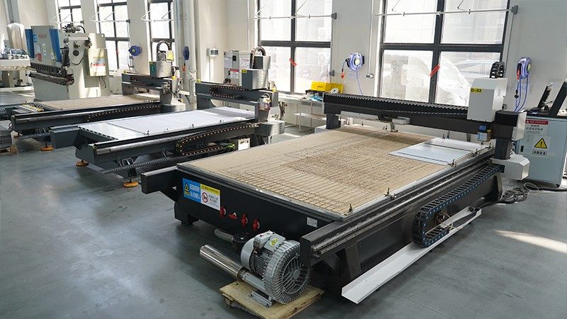 CNC machining centres cutting polycarbonate sheet at the Xinjincheng plant